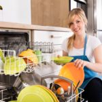 How To Fit An Integrated Dishwasher (10 Easy steps) Woman Arranging Plates In Dishwasher